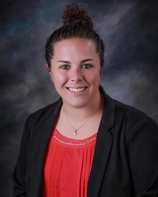 energy systems specialist portrait professional headshot with solar panel installation background